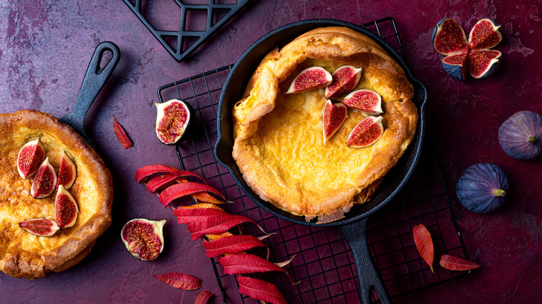 Dutch baby pancake in skillet with figs