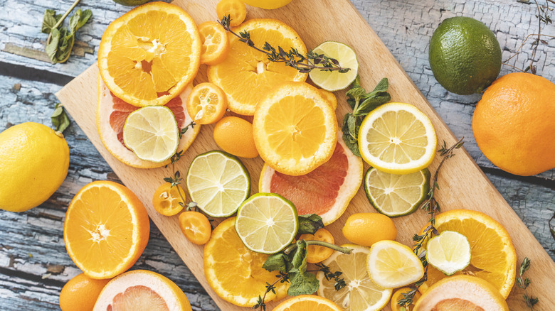 Citrus fruits on cutting board