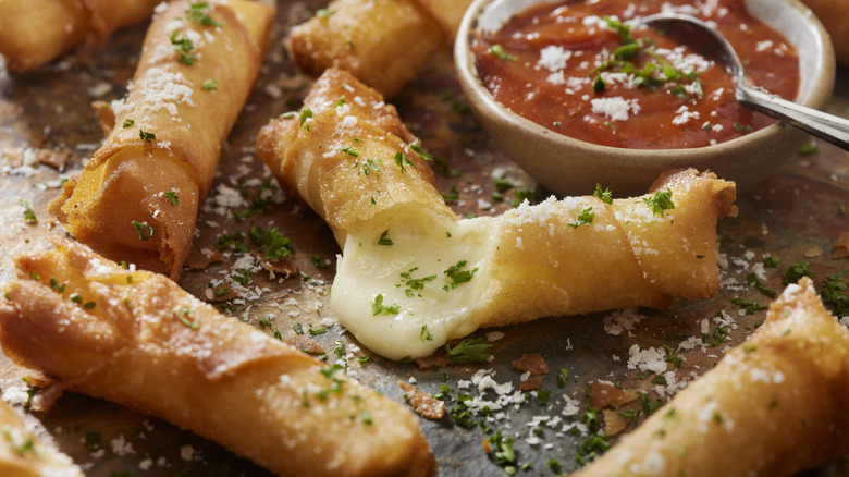 Spring rolls with melted cheese and marinara dip