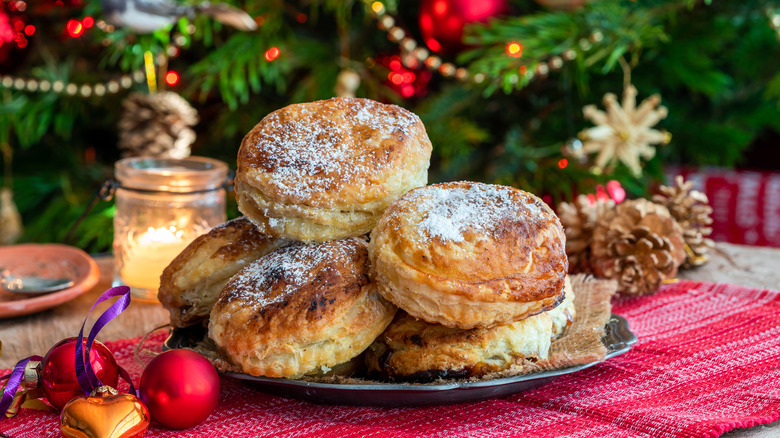 Puff pastry pies with Christmas tree in background