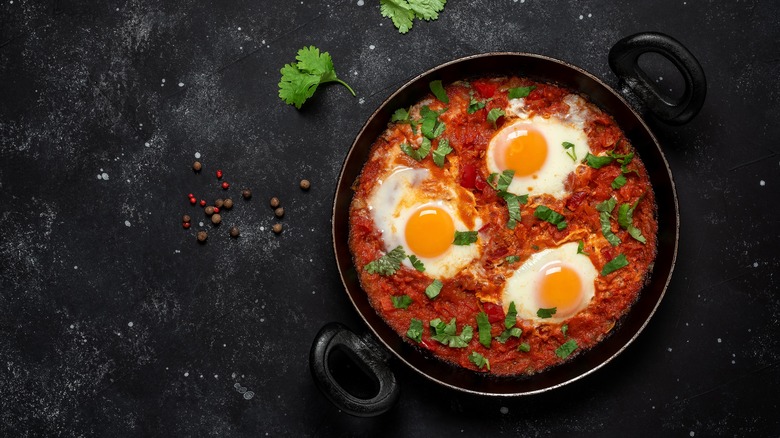 shakshuka in pot black background