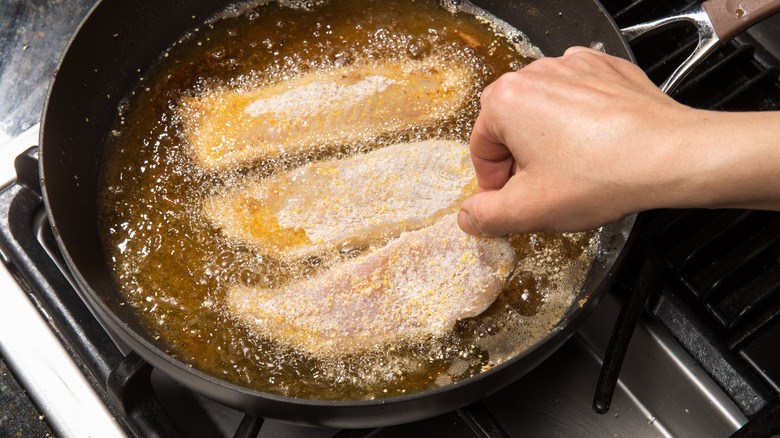 pan frying fish fillets in hot oil