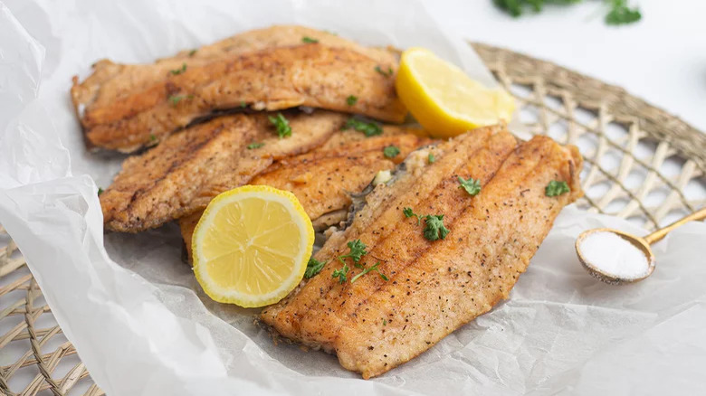 fried trout fillets with lemon slices