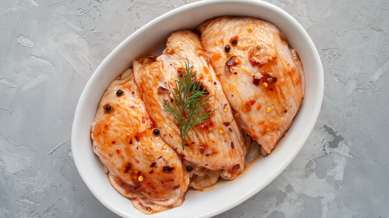 Bowl with marinated chicken