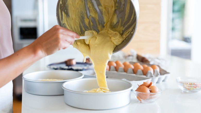 batter pouring into tins