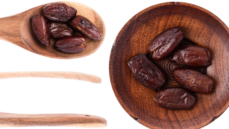 Dried halawi dates against a white background