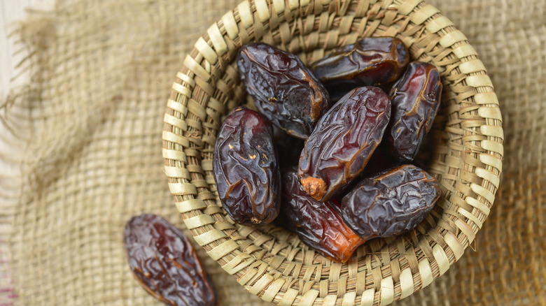 Mejdool dates in a small natural basket