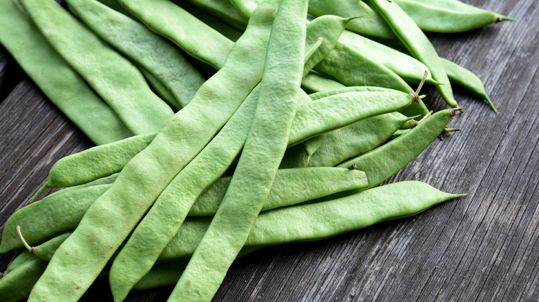 Romano beans on a wooden table