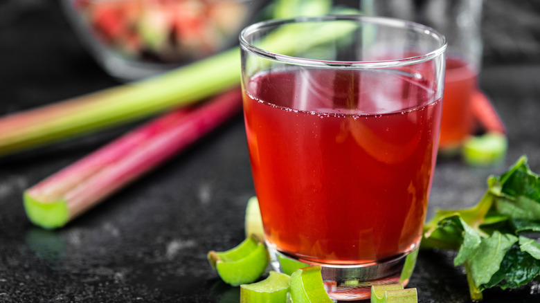 Red liquid with rhubarb stalks.