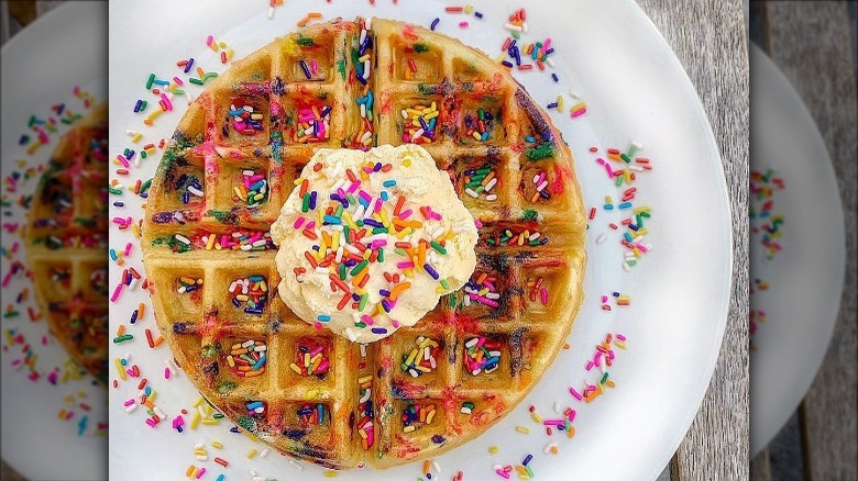 Waffle with sprinkles, whipped cream