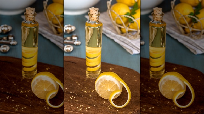 Lemon-infused olive oil on wooden board