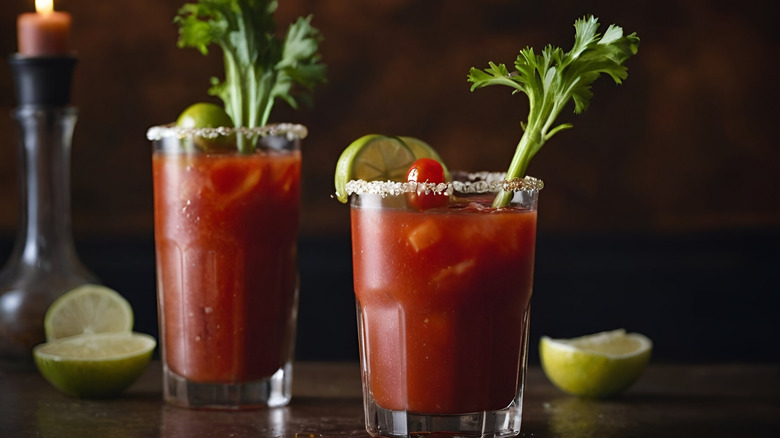 Bloody marys with celery, sliced limes, and candle in back