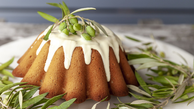 Olive oil bundt cake with olives and olive leaves