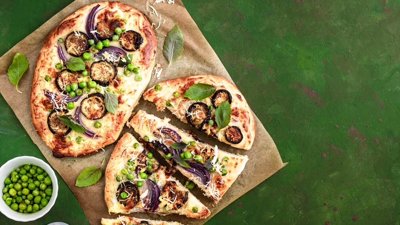 Vegetable pizzas with peas