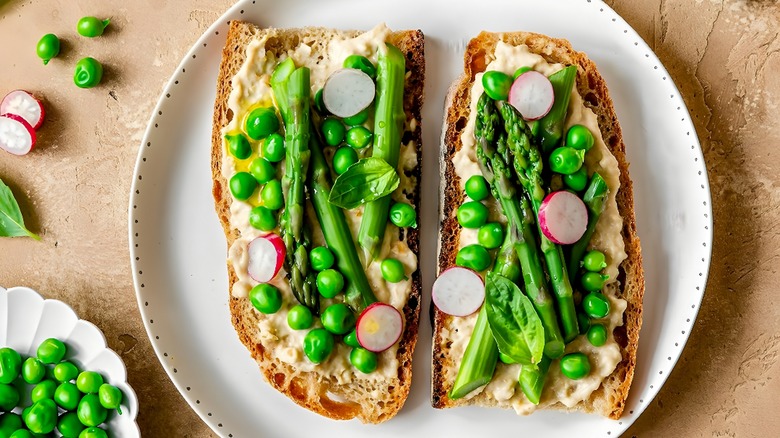 Open sandwiches topped with peas