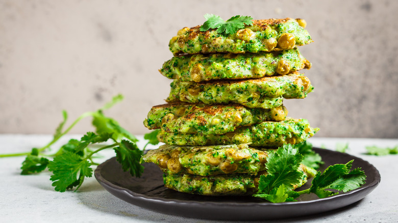 A pile of pea fritters on a plate