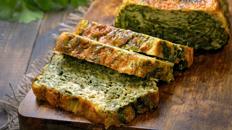 Sliced spinach bread on cutting board