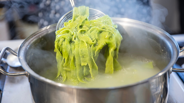 Spinach pasta in a cooking pot