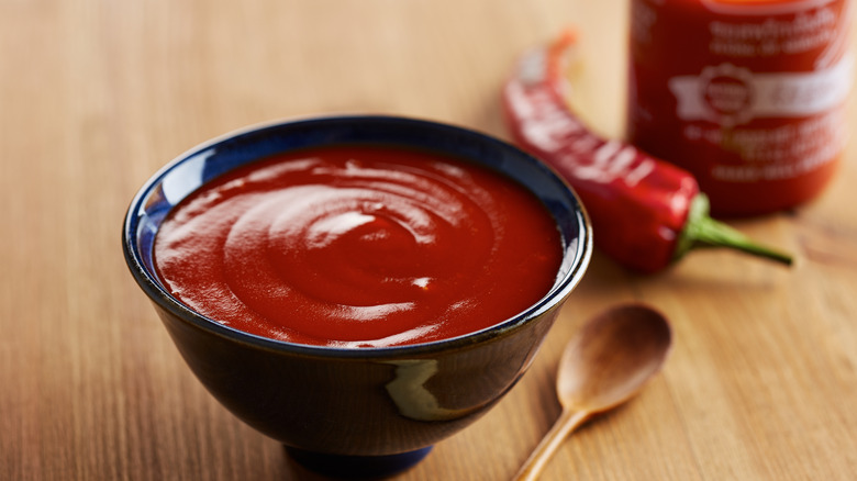 Bowl of sriracha and spoon