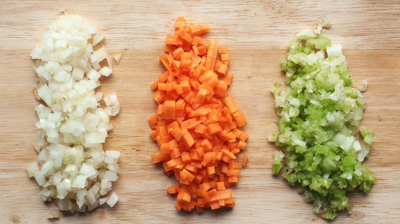 Diced vegetables on wooden background