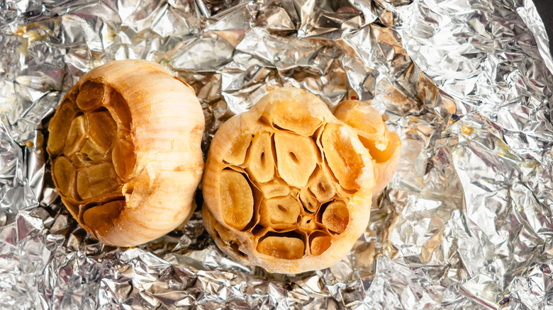 Roasted garlic bulbs on piece of foil