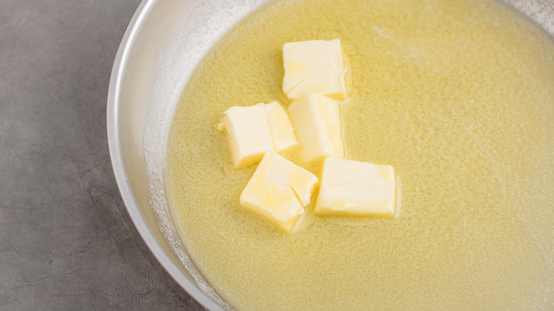 Cubed butter melting in pan