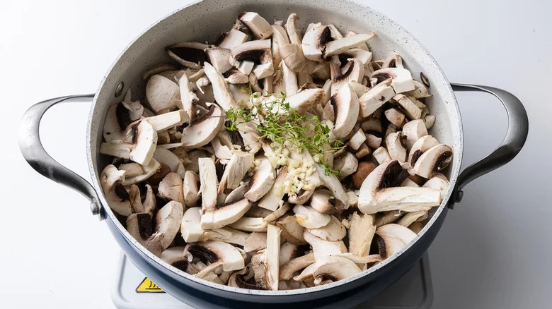 chopped mushrooms in sauceban