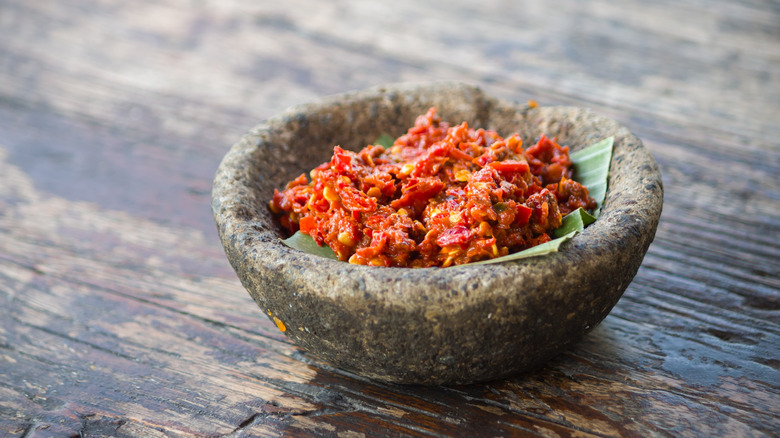 Fresh chili sauce in stone bowl