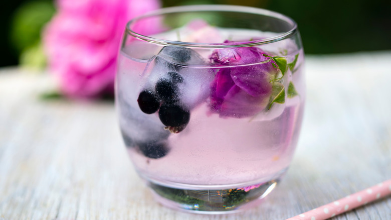 edible flower ice cubes in a gin and tonic