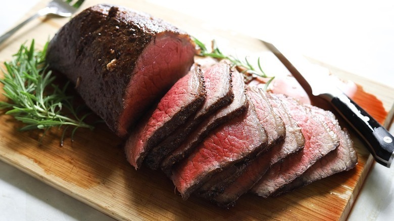 sliced roast beef on board