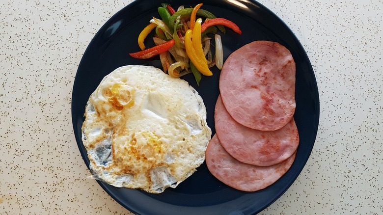 Fried eggs, peppers and canadian bacon