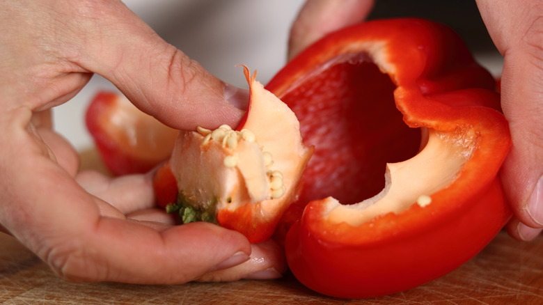 red bell pepper core seeds hand