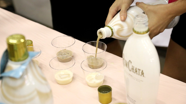 pouring rumchata liqueur bottle