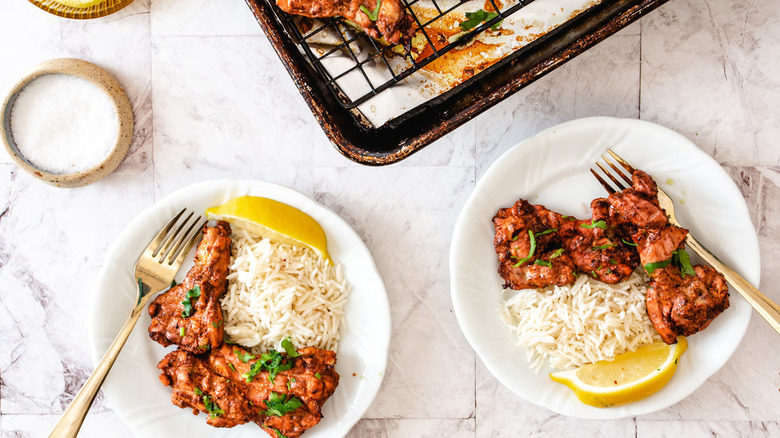 chicjen and rice on plates