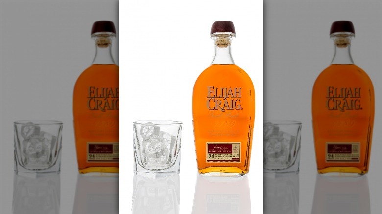 Glass with bottle of Elijah Craig