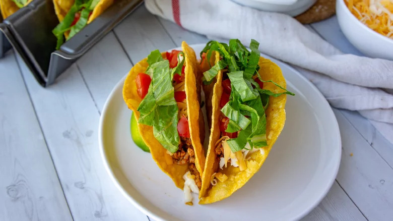 Ground turkey tacos with lettuce, tomato and cheese