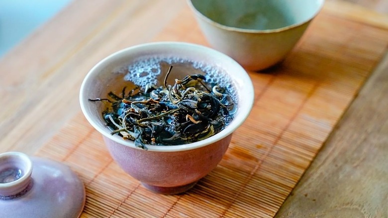 Yellow tea leaves steeping 