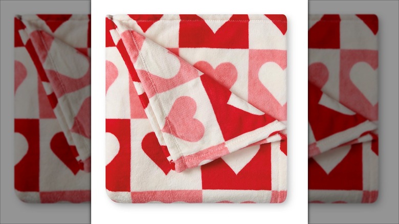 Throw blanket with pink, white, and red hearts