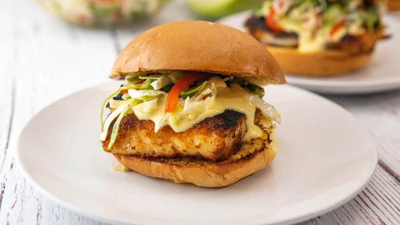 Fried fish sandwich bun with coleslaw and aioli