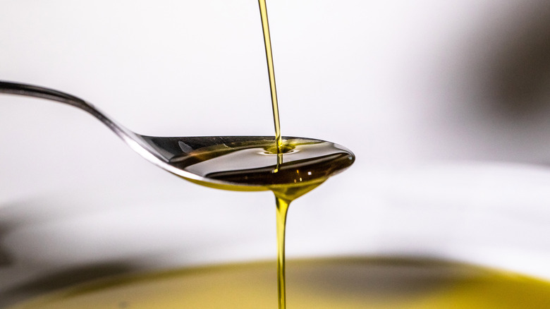 olive oil in a spoon