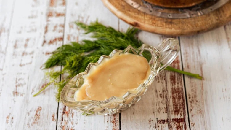 Brown gravy in glass gravy boat