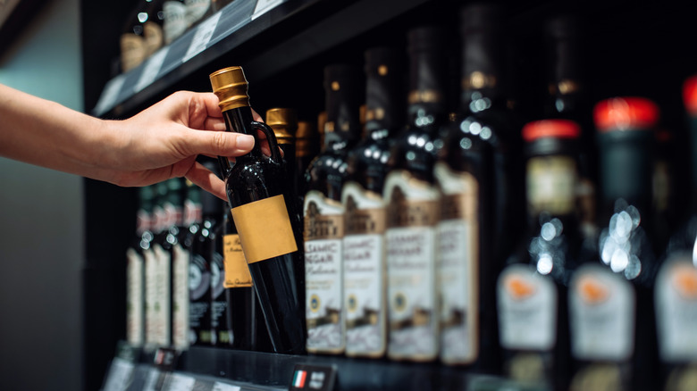 Selecting balsamic vinegar from shelf