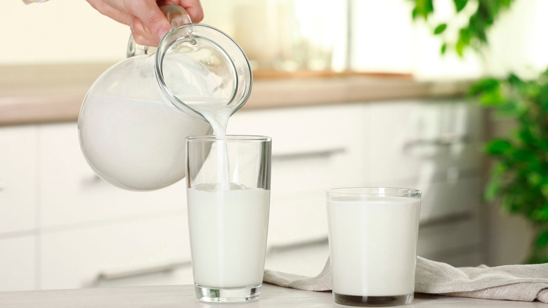 Pouring pitcher of cream