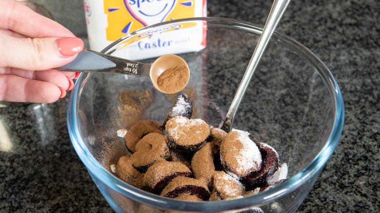 adding cinnamon, sugar, cherries 