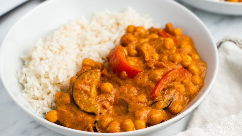 15-minute chickpea vegetable curry with rice in white bowl