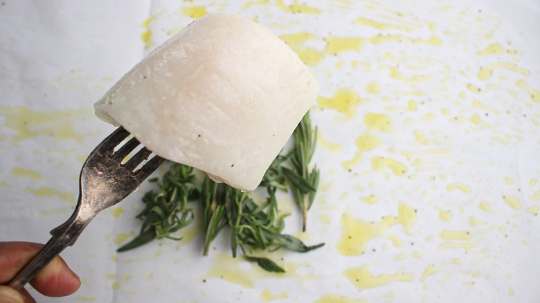 Fresh herbs and oil for the halibut parcels