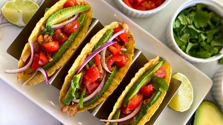 jackfruit tacos with avocado, tomato, cilantro, and lime