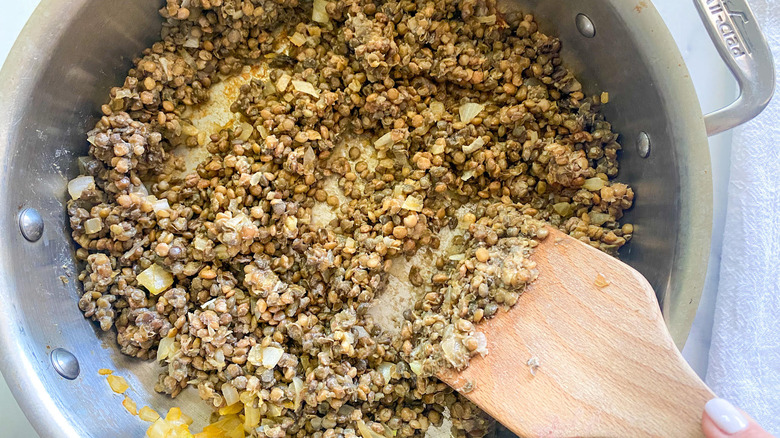 stirring lentils into onion mixture 