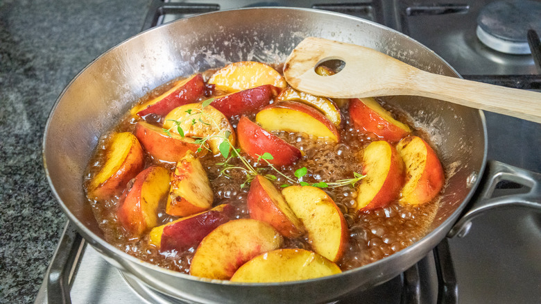 peaches in pan with thyme and caramel