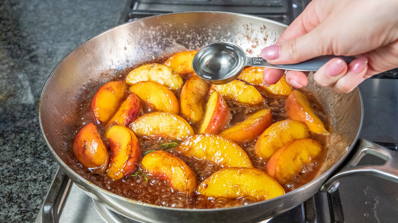 water added to peaches in pan